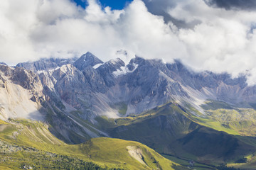 Beautiful summer scenery in the Dolomite Alps, Italy, with dramatic storm clouds