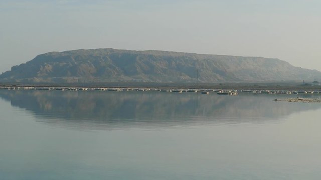 Zoom in to mountain at the far end of the Dead Sea