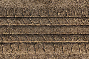 Car tire track on the sand