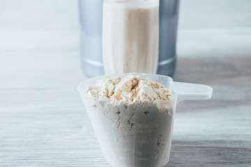 Close-up scoop with serving of dry protein powder