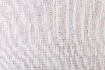 Texture of white gauze fabric for the background.