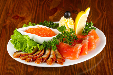 Trout fillet, red caviar and eel