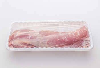 Pork fillet for sell in white plastic tray