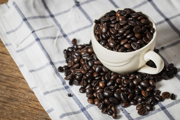 A coffee bean is a seed of the coffee plant and the source for coffee.