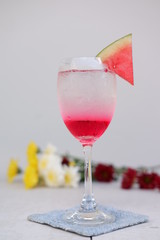 red cocktail with strawberry