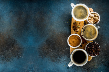 Coffee cups with beans and ground coffee