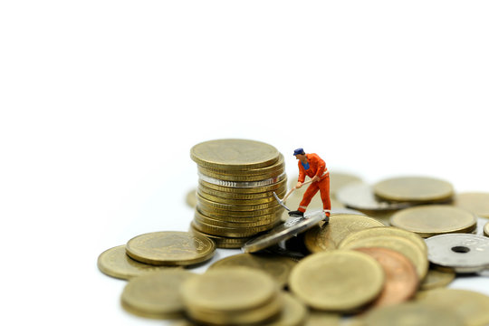 Miniature people : worker digging on coins ,Money, Financial, Business Growth concept.