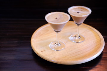 espresso martini cocktail on wood tablev