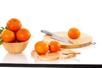 orange goldern and knife  on the white table on white background isolate 