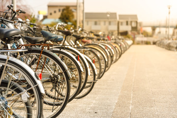 bicycle line parking at train station in Japanese evening time  over sunset background 
