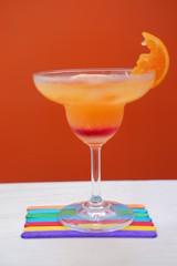orange margarita on wood table