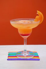 orange margarita on wood table