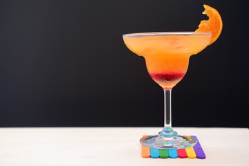 orange margarita on wood table