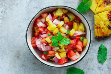 Grilled Pineapple Tomato Salsa or Salad overhead view - obrazy, fototapety, plakaty