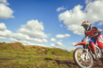 woman on enduro motocross in motion, desire for victory, dynamics of speed