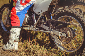 woman on enduro motocross in motion, desire for victory, dynamics of speed