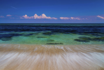 Fototapeta na wymiar Beautiful summer landscape with sea waves on the beach