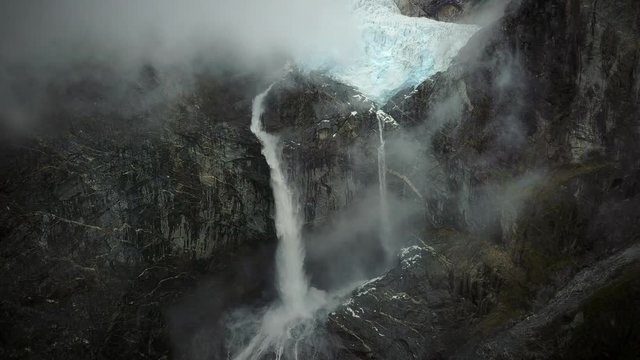 Aerial view of misty waterfall in Cisnes, Region de Aysen, Chile.