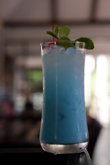 blue hawaiian cocktail at counter bar
