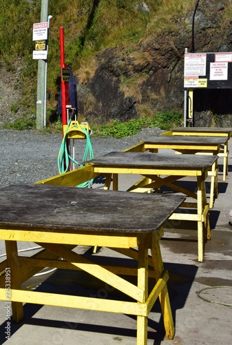Wooden Tables Used For Outdoor Fish Cleaning Station And Water Hose Wooden Tables Used For Outdoor Fish Cleaning Station And Water Hose In A Small Fishing Community