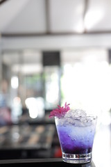 blue cocktail on counter bar