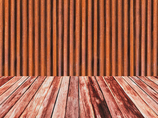 Old zine with rust texture background and floors are made of wood. The empty wall is used for decorating or displaying work.