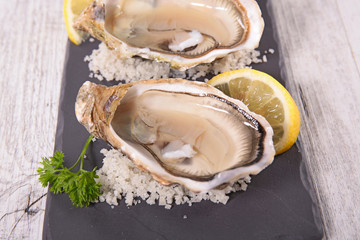 opened oyster and lemon