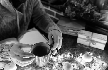 monochrome photo of man with a blank book in his hands for the N