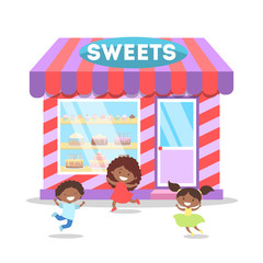 Obraz na płótnie Canvas Children running in front of candy shop.