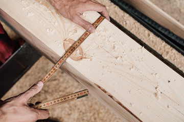 measurement and marking of a wooden beam