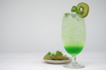 kiwi fruit soda on white background