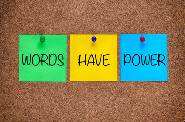 Phrase Words Have Power on corkboard.