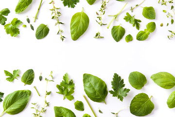 Green fresh aromatic herbs pattern isolated on white background. Top view. Copyspace.

