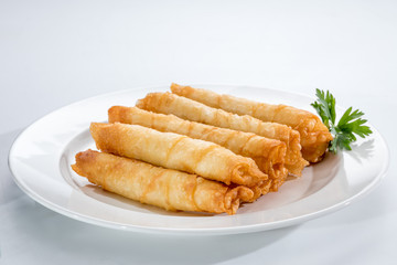 Cigar Pastries on a white plate.