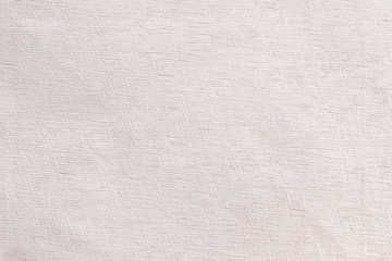 Fototapeta na wymiar Light patterned fabric background. Light cloth texture. Seamless white canvas fabric texture wallpaper.
