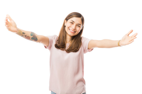 Loving Woman Offering A Hug Over White Background