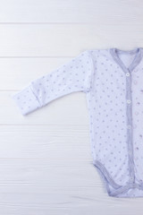 White baby sleepwear onesie with stars.