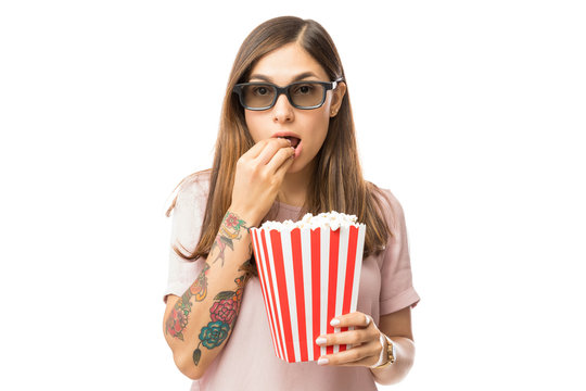 Beautiful Female Eating Popcorn While Watching 3D Film