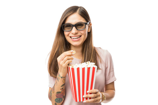 Woman Wearing 3D Glasses While Enjoying Movie And Popcorn
