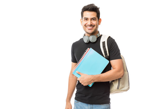 Smiling Young College Student With Books And Backpack