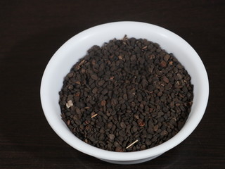 black Sesame close up shot on wood background,Black Sesame seeds in wooden isolated on wooden background, Black Sesame Seed in White Bowl on Wooden background, Black Sesame Seeds in Hand,