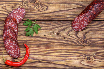 sausage on a wooden table, view from above