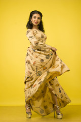 beautiful indian female model in beige dress