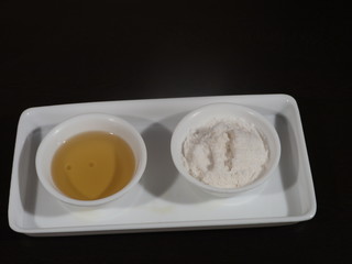 White sea salt isolated on Wooden background,Olive oil on a wooden background, Salt and Olive Oil in White Bowl on Wooden Background, bowl of fresh olive oil and Salt on Wooden Background