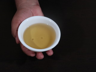 Olive oil on a wooden background, Fresh Olive Oil in White Bowl on Wooden Background, Olive in White Bowl on Hand in Wooden Background, Olive Oil