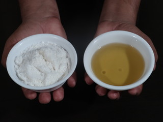 White sea salt isolated on Wooden background,Olive oil on a wooden background, Salt and Olive Oil in White Bowl on Wooden Background, bowl of fresh olive oil and Salt on Wooden Background