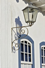 Old lamp with shadow on the white wall