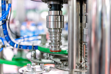 Modern filling machine of beverage in the factory