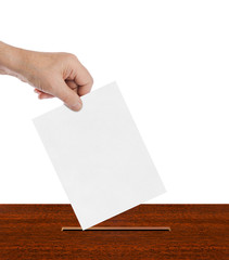 Hand with paper ballot