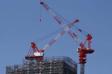 Fototapeta na wymiar Crane and building construction as industry background.